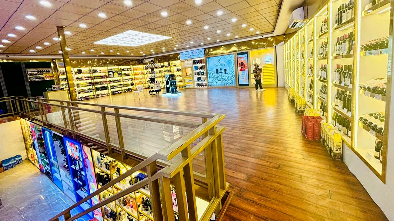 Bright beverage retail showroom with display shelves