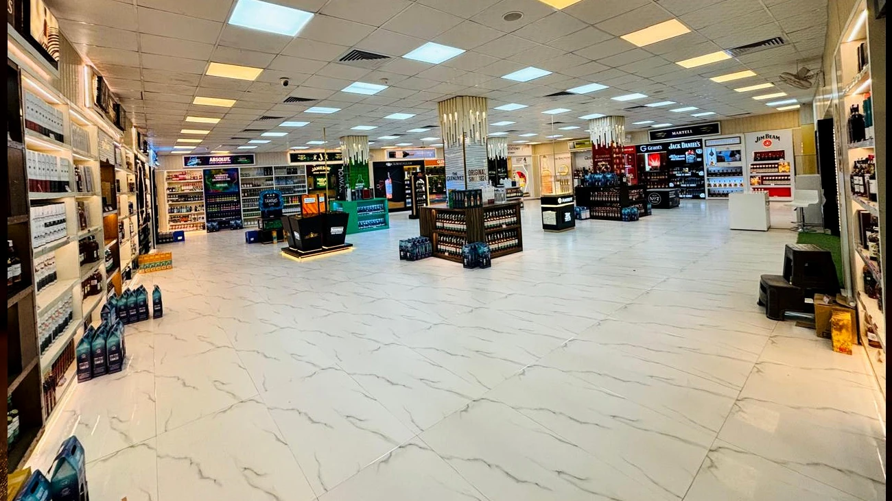 Spacious beverage shop interior with illuminated displays